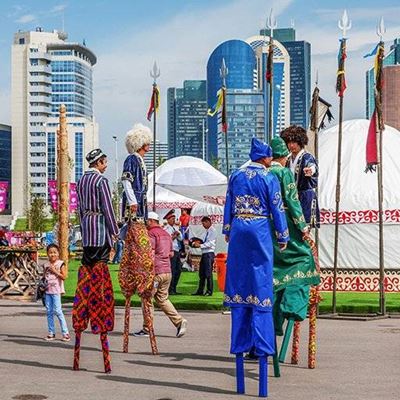 COSTUMES, TRIDENT, FLAGS, SILK, FESTIVAL, STILTS, CEREMONY, BUILDINGS, TENTS