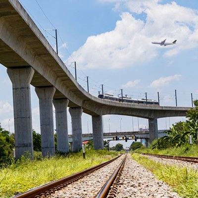 PLANE, TRAIN, CLOUDS, RAILS, CARRIAGE, OVERPASS, GRAVEL, CONCRETE, SUPPORTS
