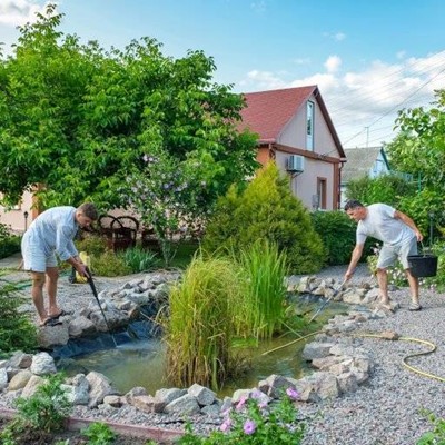 GARDEN, POND, MAINTENANCE, STONES, GRASSES, BUCKET, CLEANING, HOSE, WATER, SHORTS, GRAVEL, HOUSE