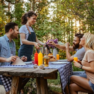 FRIENDS, MUSTARD, SUNGLASSES, APRON, TABLECLOTH, PLATE, FOOD, KETCHUP, OUTDOORS, FLOWERS, TREES, DRINKS