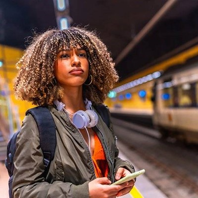 WIRE, JACKET, COMMUTE, PLATFORM, CURLS, WAITING, HEADPHONES, PHONE, STRAP, STATION, TRAIN
