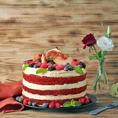 CAKE, SPONGE, FIG, BLUEBERRIES, VASE, LAYERS, RASPBERRIES, FROSTING, NAPKIN, PLATE, KNIFE, MINT