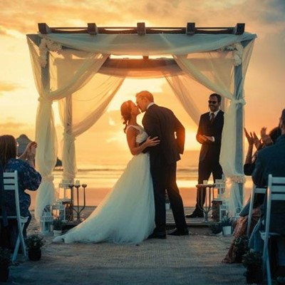 GROOM, GUESTS, DRESS, CEREMONY, OFFICIANT, VOWS, SUNSET, BRIDE, WEDDING, OCEAN, PERGOLA, CANDLES