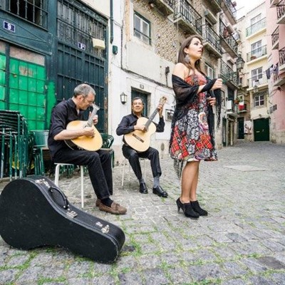 GUITAR, SINGING, COBBLESTONE, BAND, DRESS, CASE, SHAWL, TABLES, BALCONY, STREET, EARRING, STRINGS