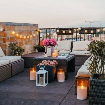 TERRACE, LIGHTS, CANDLES, PLANTS, TABLE, SEATING, CUSHIONS, EVENING, BALCONY, FLOWERS, BRICKS, LANTERN